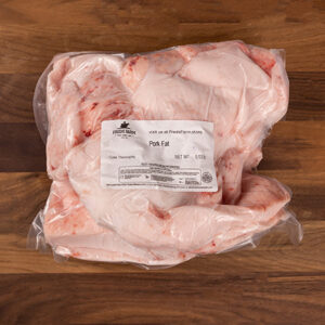 Vacuum-sealed bag of pork fat on a wooden surface, label reads Pork Fat.