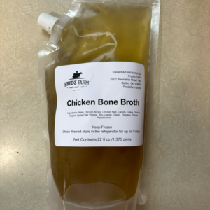 Pouch of Fred's Farm Chicken Bone Broth with a white label listing ingredients and 22 oz (1.375 pints) total.